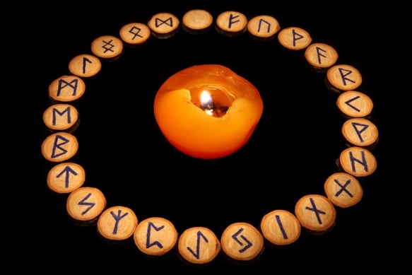Runes with candle